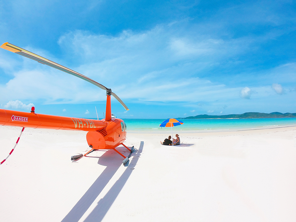 Fly over the whitsunday islands on a helicopter tour. Whitehaven Beach Helicopter Tour Scenic Flight Booker